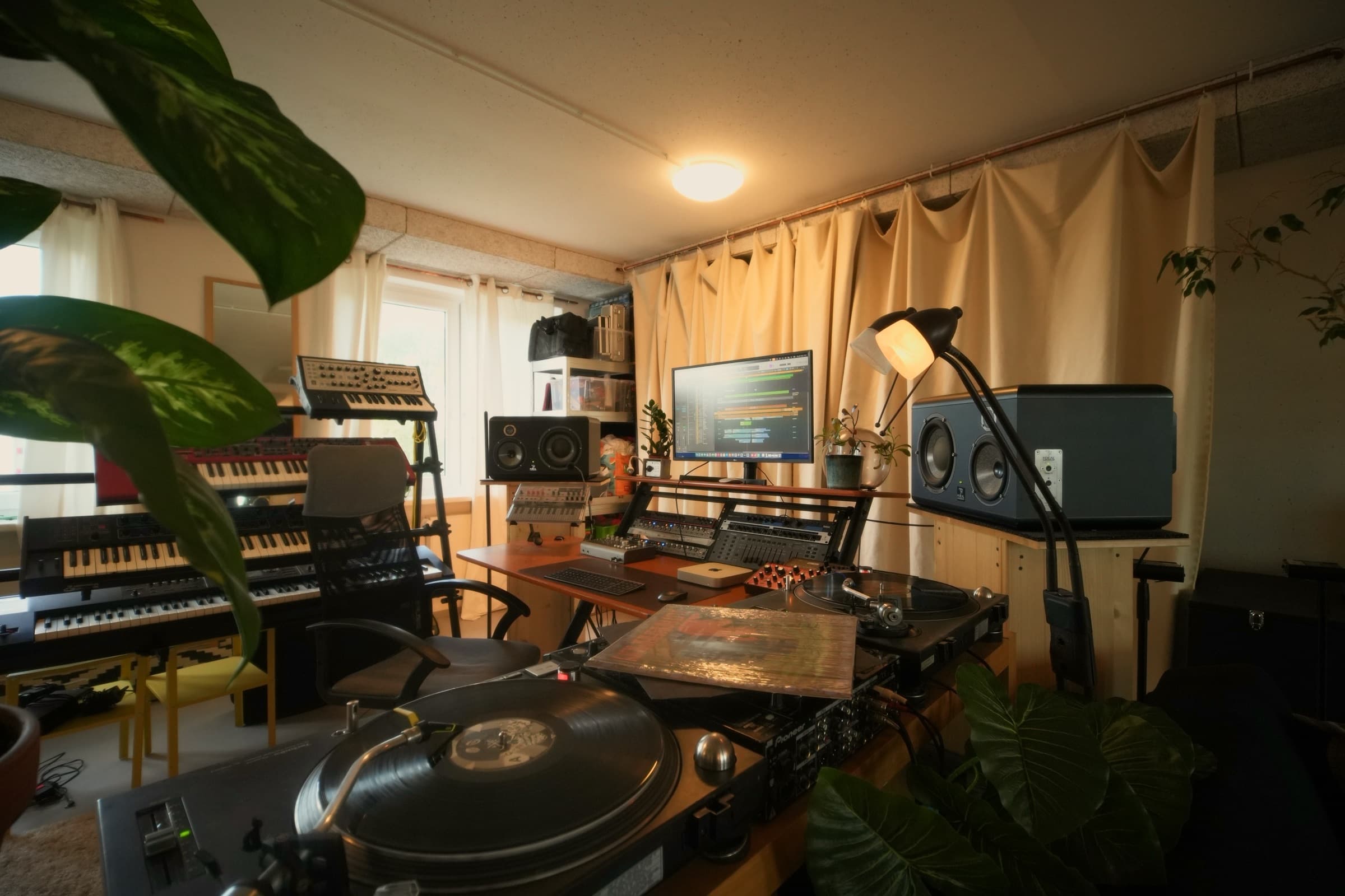The control desk with the vinyl shelf alongside