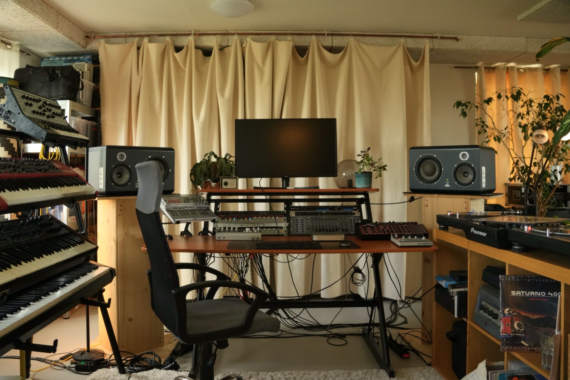 The control desk, monitors either side, facing the live room